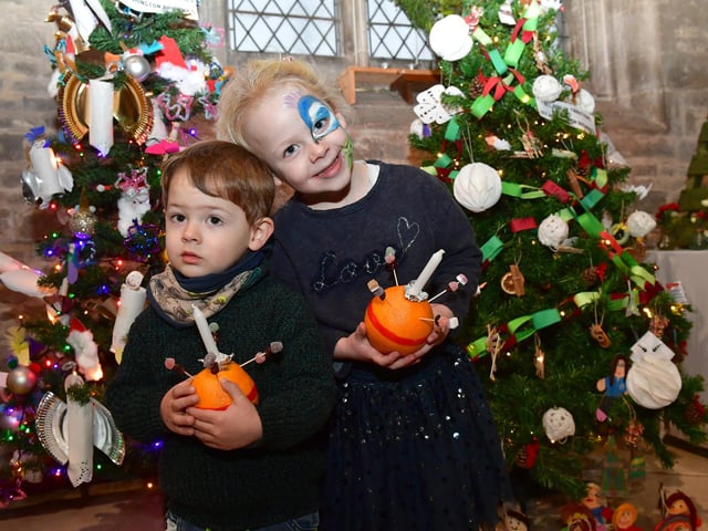 Lilly, aged four, and William, two, of Great Hale with their Christingles.