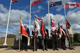 Flags flying at the official opening. Image: WLDC