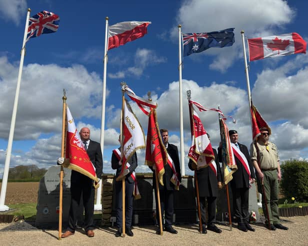 Flags flying at the official opening. Image: WLDC