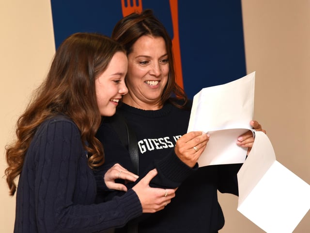 Ella Smith celebrates results with family.