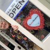 Ruth Burrows at her Art Shop and Studio in Navigation Yard, sporting one of the #LoveSleaford promotional posters.