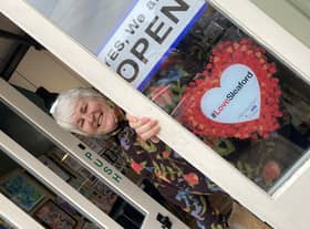 Ruth Burrows at her Art Shop and Studio in Navigation Yard, sporting one of the #LoveSleaford promotional posters.