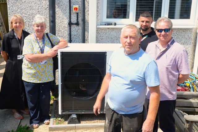 Left to right: SKDC’s Director of Housing and Projects Alison Hall-Wright, Cabinet Member for Housing Virginia Moran, householder Andrew Slatters, E.ON Project Manager Cameron Keen and SKDC’s Retrofit Project Officer John Smart with Andrew’s air source heat pump. (Photo: SKDC)