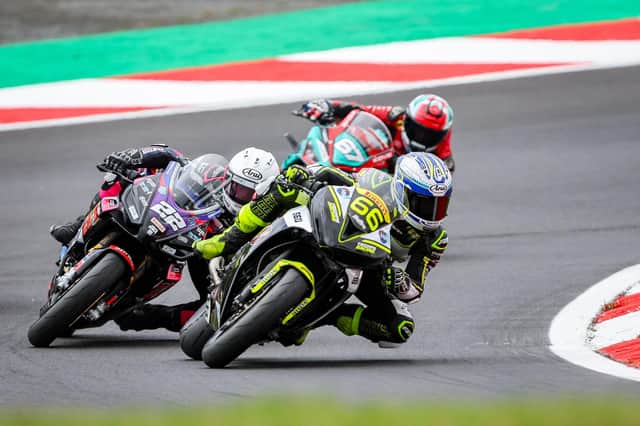 Katie Hand in a 3 way battle at Brands Hatch. Photo: Colin Port Images