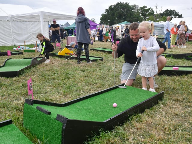 Liam Stewart of Great Hale with Poppy Stewart 3 on the crazy golf game. Photos: David Dawson