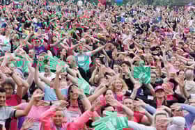 Race for Life participants take part in the warm up