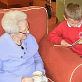 A Staniland Academy pupil takes a resident through a story.
