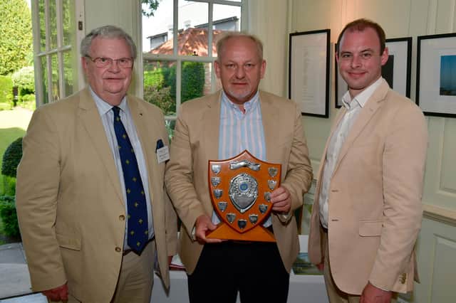 Dudley Bryant, chairman of Civic Group, and Matt Warman MP, present the first place shield to winner Shane Gray (centre).