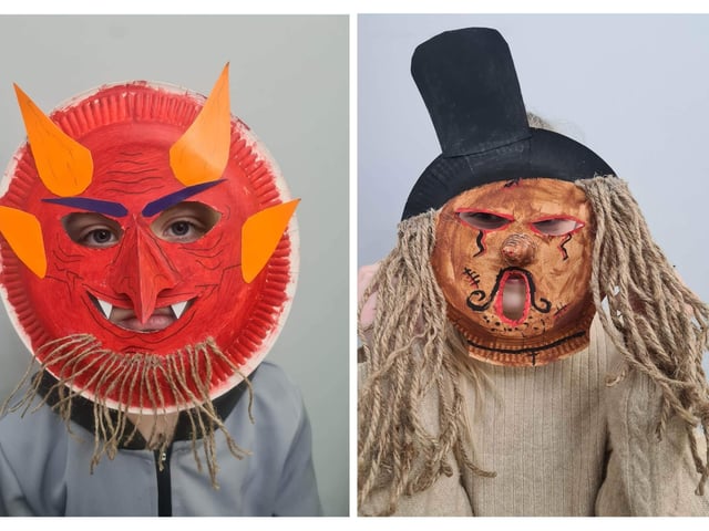 Two of the festival masks made by children in Boston.