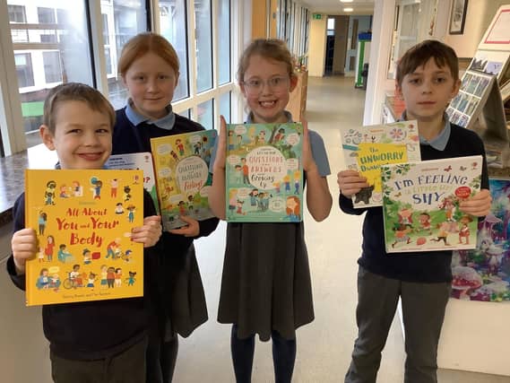 L to R: Simon, Verity, Violet, Josh with some of the books gifted to Donington on Bain Primary School