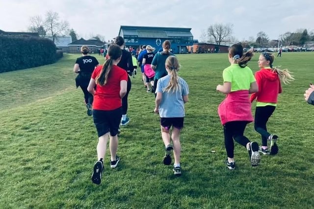 Runners of all ages on the four and a half laps of the school field. Photo: HET