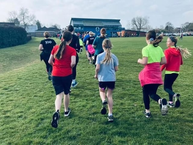 Runners of all ages on the four and a half laps of the school field. Photo: HET