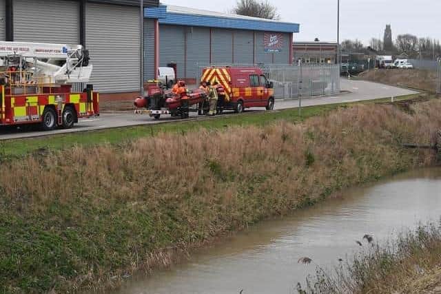 Emergency services at the scene where Mr Stolarek's body was found, in the water at the Chain Bridge Pumping Station, Boston.