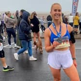 Becky Carr celebrates completing the ABP Humber Coastal Half-Marathon at Cleethorpes in September.