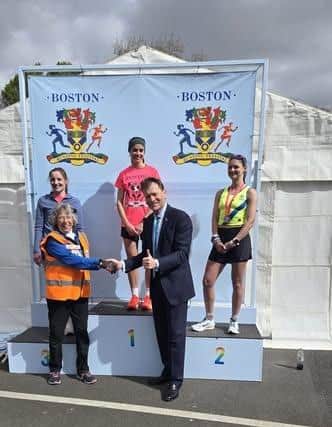 MP Richard Tice getting on with his  work 'representing the people of Boston and Skegness ' by handing out medals at the Boston Marathon.