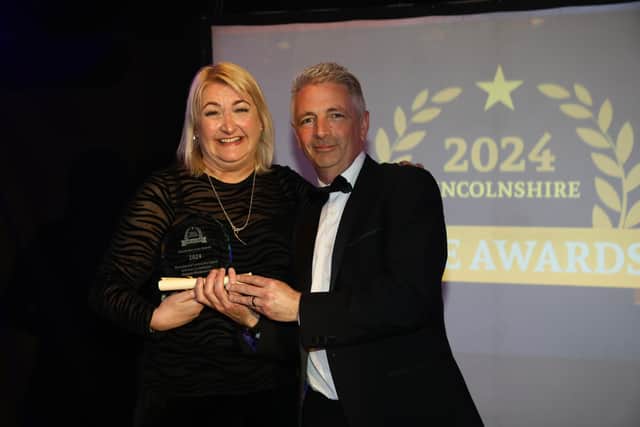 The Activities Co-ordinator of the Year, Melanie Wordsworth, received her award from Paul Reames, Director of Bluecube