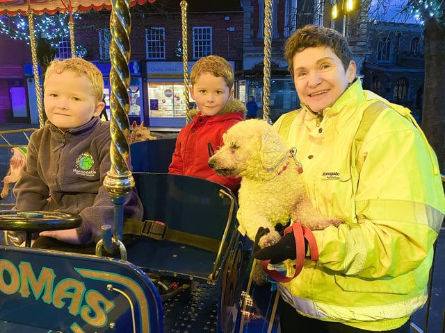 Isaac, Logan and Pauline Codd try out the fairground wurlitzer.