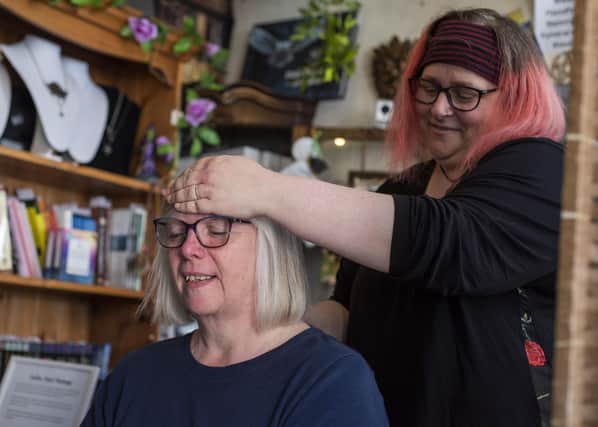 Helen Rogers receives an Indian head massage from Carrie-May Mealor. Photos: Holly Parkinson Photography