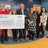 Lucy Burnip (left), of the Stroke Association, accepting the donation at Chattertons' Lincoln office.