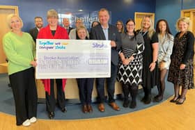 Lucy Burnip (left), of the Stroke Association, accepting the donation at Chattertons' Lincoln office.