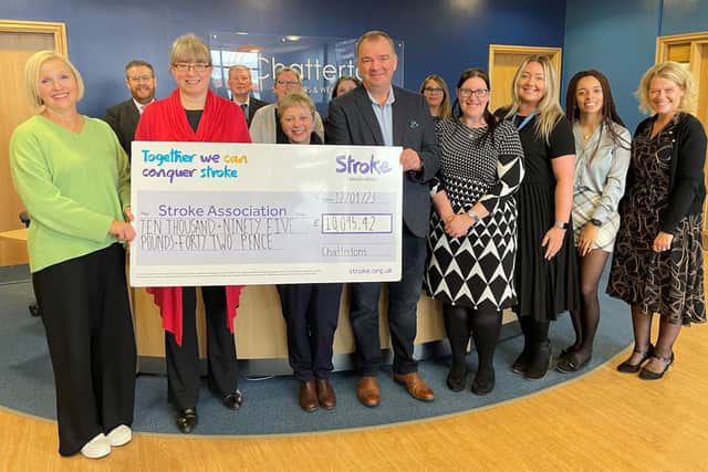 Lucy Burnip (left), of the Stroke Association, accepting the donation at Chattertons' Lincoln office.