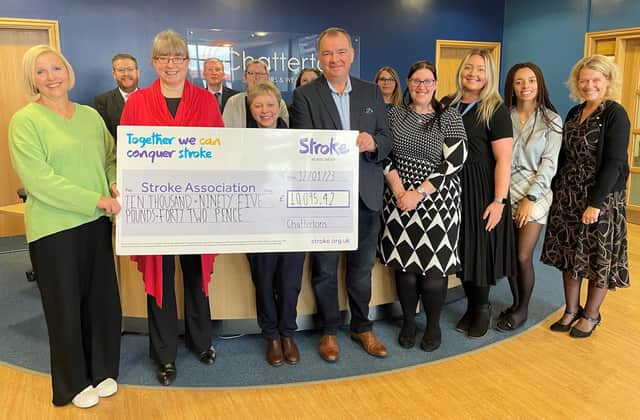 Lucy Burnip (left), of the Stroke Association, accepting the donation at Chattertons' Lincoln office.