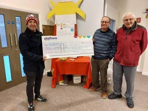 Platform’s Director of Platform Hub and Income Management, Michael Bruce (left) is pictured presenting the £1,000 cheque to Mark Harrison of the Lighthouse Project (centre) and their treasurer Robin Barrow (right).
