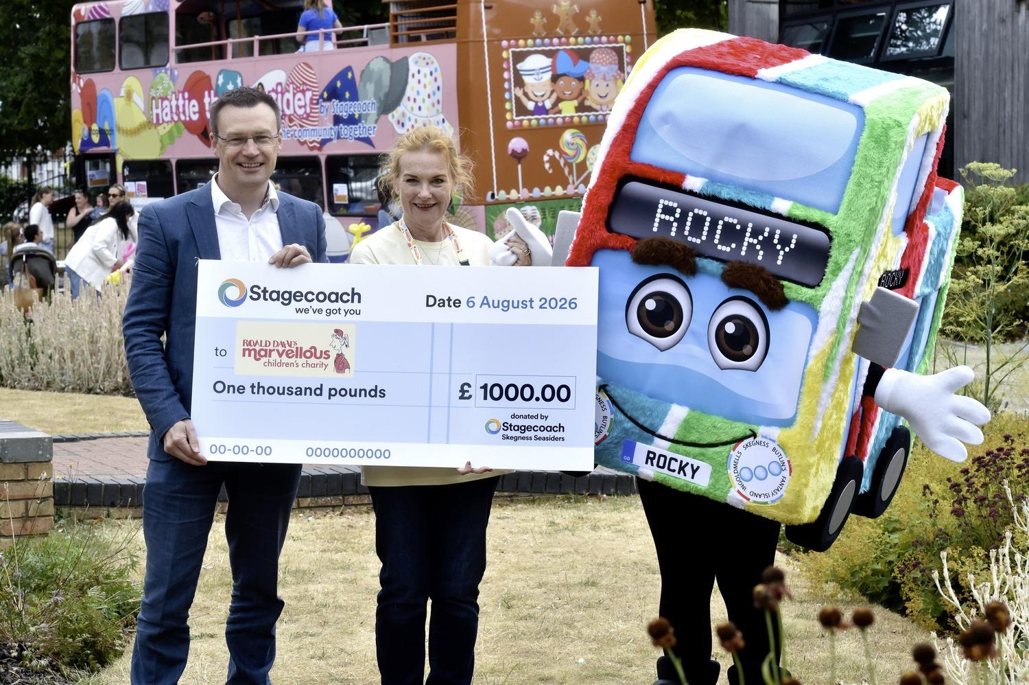 Matt Cranwell hands a cheque to Emma Johnson, from Roald Dahl’s Marvellous Children's Charity.