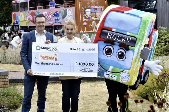 Matt Cranwell hands a cheque to Emma Johnson, from Roald Dahl’s Marvellous Children's Charity.