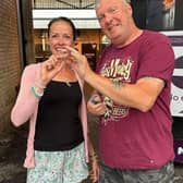 Liz Thornton is reunited with her precious feather ring by metal detector Don Graves.