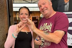 Liz Thornton is reunited with her precious feather ring by metal detector Don Graves.