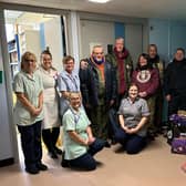 The riders (right) deliver chocolate to staff at the children's ward at Pilgrim Hospital in Boston.