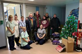 The riders (right) deliver chocolate to staff at the children's ward at Pilgrim Hospital in Boston.