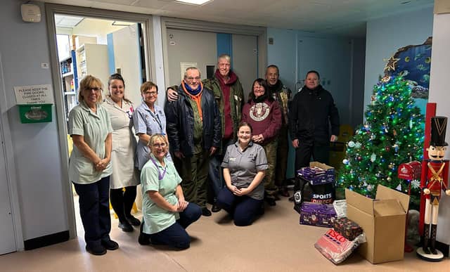 The riders (right) deliver chocolate to staff at the children's ward at Pilgrim Hospital in Boston.