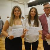 Kitty MacPherson, left, and Scarlet Dring are both delighted with their results, with a raft of 8s and 9s between them. They are pictured with headteacher Simon Porter and both will be staying at De Aston for A-levels: Media, Geography and Photography for Scarlet; English Literature, Politics and History for Kitty.