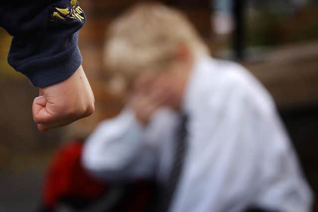 PA file photo dated 18.11 2006 showing a posed image simulating a child being bullied.