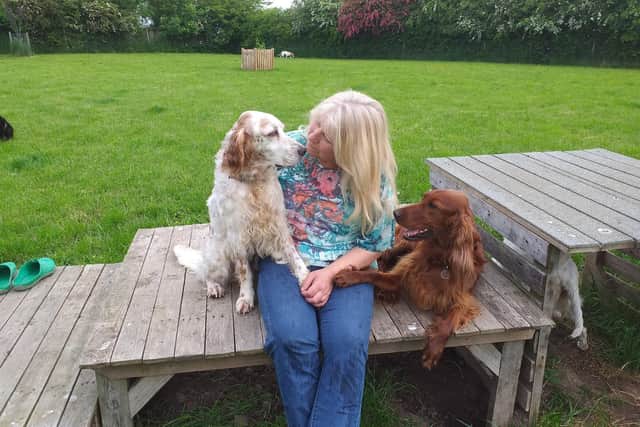 Jacqui with two of the dogs.