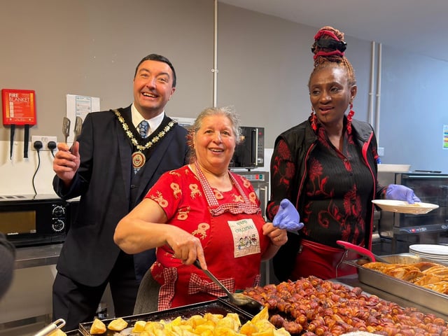Mayor Coun Jimmy Brookes gives the thumbs-up for the food ready to go out.