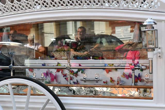 Lilia's white coffin was decorated with colourful butterflies.