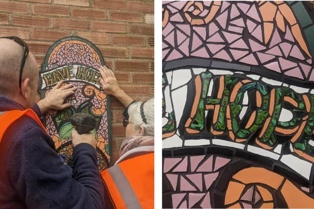 The mosaic being installed.