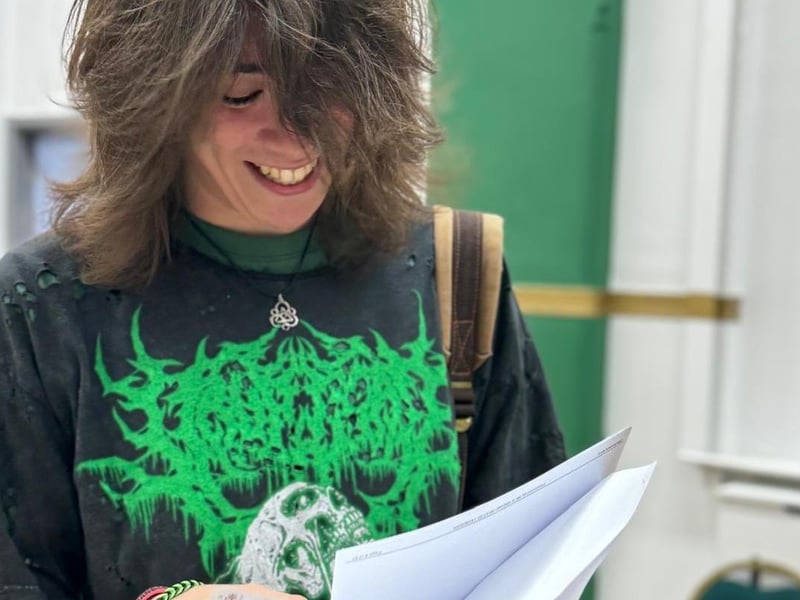 Aide Turner delighted to have achieved three A*s.