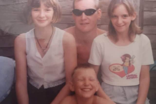 Happier times - Andrew on holiday with his family.