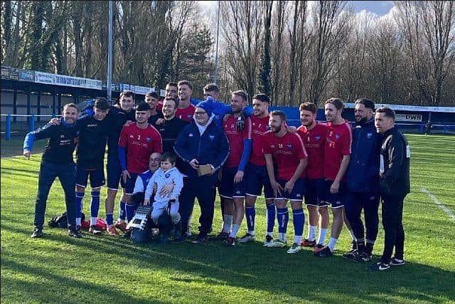 Boston Town players present Joshua Hallam with his replacement camera