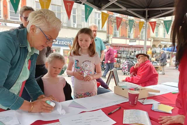 Writer Sonya Hundal pictured in a writing activity at Spalding Pumpkin Festival in 2023.