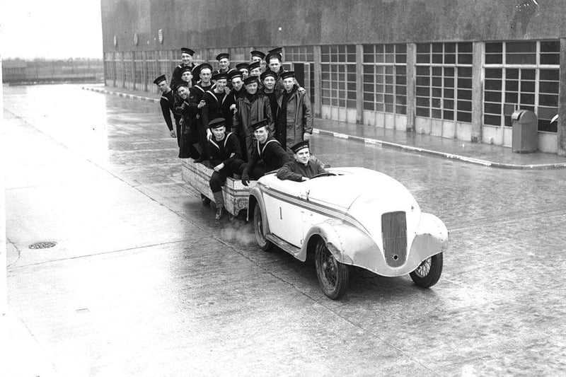 Navy recruits riding in car and trailer at the HMS Royal Arthur training centre formerly Butlin's holiday camp, Skegness, on 22nd February 1940.