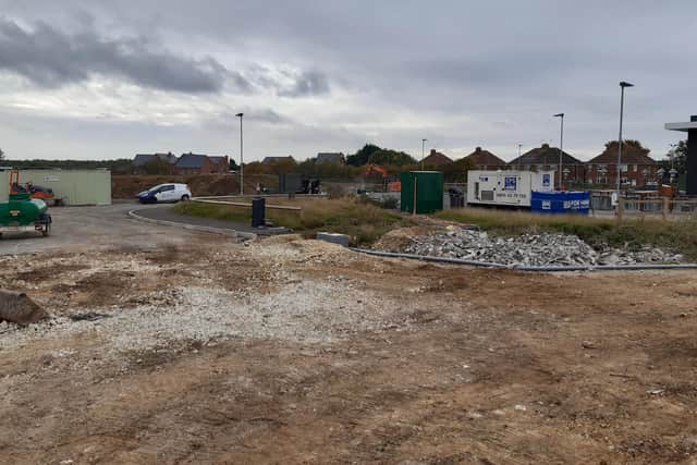 Construction work visible in the distance near where the new McDonald's stands.