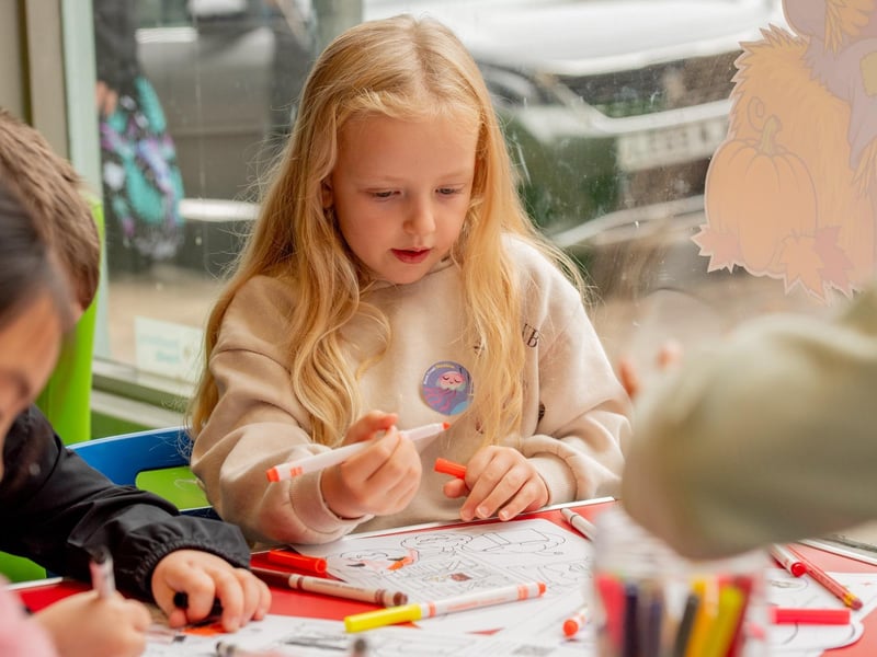 Maddie Hollingsworth joining in Sleaford Library colouring competition. Photo: NKDC/John Aron Photography
