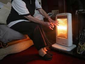 A generic stock photo of an elderly lady with her electric fire on at home in Liverpool.