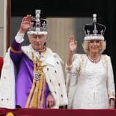 King Charles III and Queen Camilla on the balcony of Buckingham Palace following the coronation on May 6, 2023. Picture: Owen Humphreys/PA Wire.