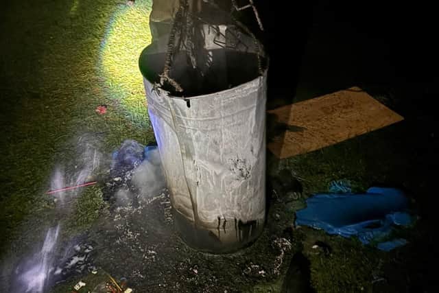 The bin was set alight, damaging the pitch.
